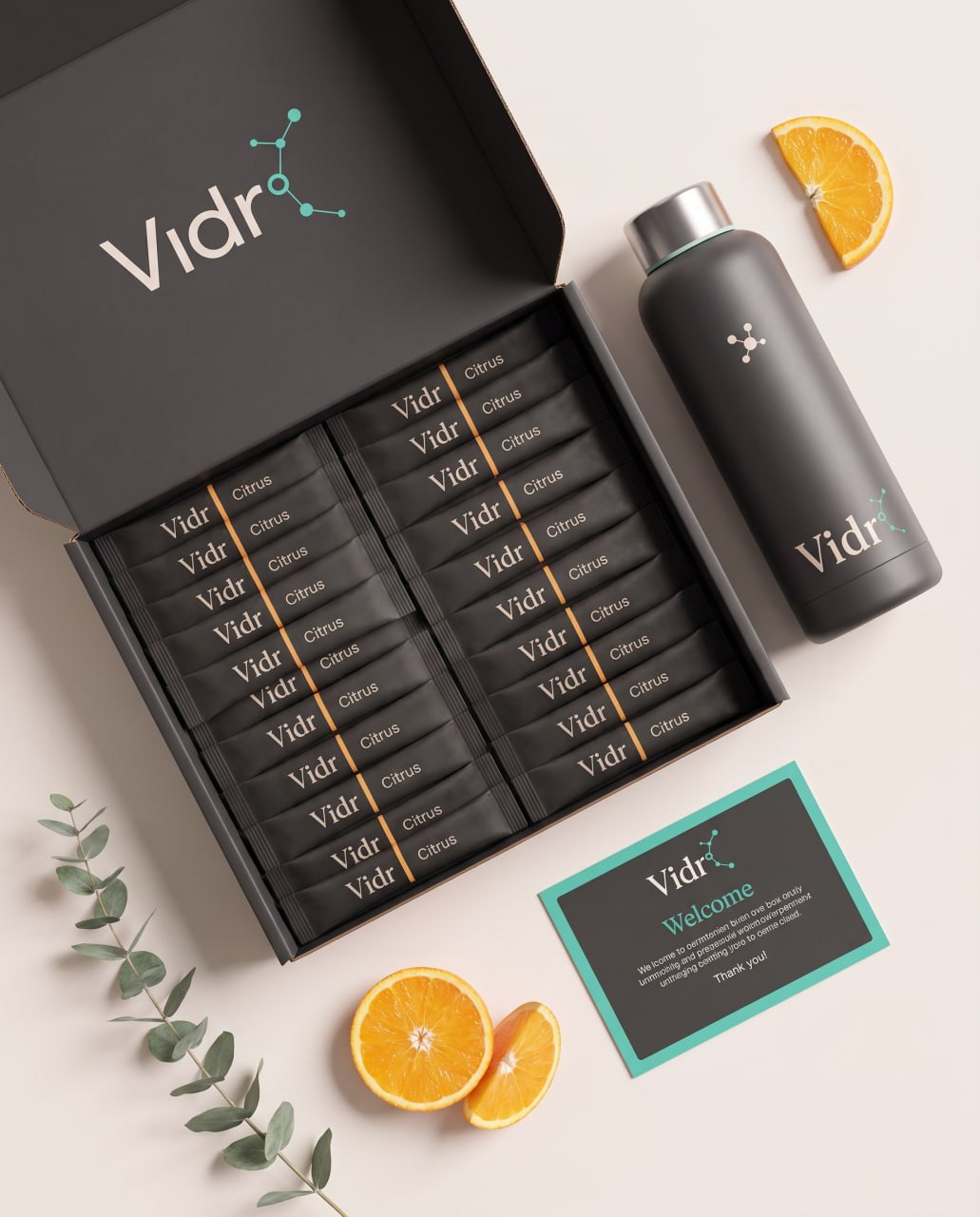 Vidr° complete box with 28 citrus sachets, steel bottle, and welcome card